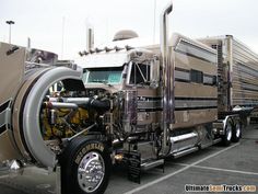 a large semi truck parked in a parking lot