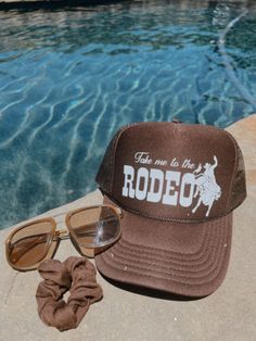 Brown high crown foam snap back trucker hat detailed with white rodeo graphic Rodeo Trucker Hat, Retro Snapback Trucker Hat For Rodeo, Retro Summer Trucker Hat For Rodeo, Thinking Cap, Cowboy Aesthetic, Custom Trucker Hats, Country Shirts, Bottom Shelf, Snap Back