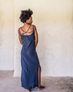 The IDIS Long slip dress is made from a light weight woven rayon. Designed with a scoop neck line and double strapes that drape nicely down the back, side splits to just below the knee and cut on the bias. These features create a dress that moves with you. Bringing you comfort and movability while maintaining a simple elegance. Our long slip looks great teamed with the Kimono Crop from the idis range for a layered effect. SIZE GUIDE XS: bust 76-82 cm | waist 64-70 cm | hips 78-84 cm S: bust 82-8 Spring Rayon Maxi Dress With Bias Cut, Spring Bias Cut Rayon Maxi Dress, Summer Beach Midi Dress With Side Slits, Spaghetti Strap Slip Dress For Beach, Flowy Bias Cut Maxi Dress For Summer, Summer Viscose Maxi Dress With Bias Cut, Unlined Slip Sundress For Beach, Summer Beach Slip Dress, Unlined, Unlined Summer Beach Slip Dress