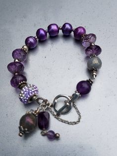 Beautiful faceted Amethyst and Pearl braclet. With safety chain. Adjustable Faceted Jewelry Bracelet, Metal Bracelet With Faceted Beads, Lavender Jewelry With Faceted Beads, Silver Amethyst Beaded Bracelets, Faceted Amethyst Purple Jewelry, Faceted Purple Amethyst Jewelry, Purple Faceted Amethyst Jewelry, Handmade Purple Metal Bracelets, Elegant Adjustable Purple Chain Bracelet