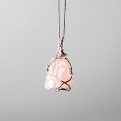 Rose Quartz Wire Wrapped Necklace  w 925 Sterling Silver Details: Gemstones: Rose Quartz Gemstone dimensions: 0.8"-1.2" (20-30 mm)  Material: 925 Sterling Silver Total necklace length: 16" /40 cm + extends to 18" /45 cm Rose Quartz, a gentle pink gem, embodies love and compassion. It resonates with the heart chakra, fostering emotional healing and self-love. Wearing Rose Quartz invites a sense of tenderness and inner harmony. ... Check out the full catalogue of raw wire wrapped crystal pendants Rose Gold Sterling Silver Pendant Crystal Necklace, Pink Gemstone Pendant Jewelry, Rose Gold Sterling Silver Necklace With Ethical Gemstones, Rose Gold Pendant With Natural Stones, Rose Gold Pendant Jewelry With Natural Stones, Rose Gold Natural Stones Pendant Jewelry, Silver Rose Quartz Gemstone Jewelry, Rose Quartz Gemstone Pendant Necklace, Minimalist Crystal Necklace With Rose Quartz Gemstone