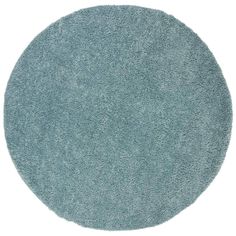 a round blue rug on a white background