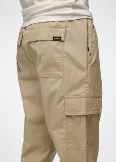 Utility-inspired cargo pants made with durable cotton ripstop and plenty of pockets for on-the-go storage. Beige Bottoms With Pockets For Outdoor Activities, Techwear Bottoms With Patch Pockets For Outdoor Activities, Techwear Bottoms With Patch Pockets For Outdoor, Utility Parachute Pants With Multiple Pockets For Outdoor, Urban Cargo Pants With Pockets For Outdoor Activities, Outdoor Utility Parachute Pants With Multiple Pockets, Urban Khaki Cargo Pants With Patch Pockets, Functional Khaki Cargo Style Bottoms, Khaki Parachute Pants With Patch Pockets For Outdoor