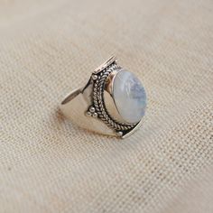 Gemstone - Natural Rainbow Moonstone Gemstone Size - 10x14 mm oval Metal - Sterling Silver natural AAA rainbow moonstone set with a sterling silver handmade ring Each Ring made with Precision and love, these rings are perfect for everyday use and a perfect accessory to wear at work. Rings can be customized on request and gemstone can be switched to any other as per requirement. Other beautiful designs uploaded with fabulous gemstones. kindly visit my store to view the complete collection. Feel f Silver Oval Moon Phase Ring, Silver Oval Ring With Moon Phase, Silver Oval Rings With Moon Phase, Bohemian Oval Cabochon Moonstone Ring, Sterling Silver Oval Rings With Moon Phase, Sterling Silver Oval Rings With Moon Phase Detail, White Moonstone Ring With Oval Cabochon, White Oval Cabochon Moonstone Ring With Gemstone, Oval Large Stone Moonstone Wedding Ring