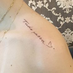 the back of a woman's shoulder with her name written on it