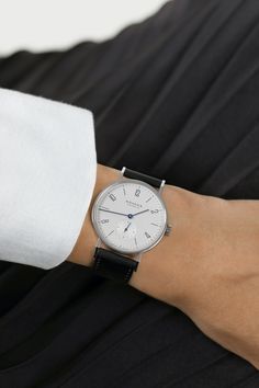 The classic watch in its original form, with the unisex NOMOS diameter of 35 millimeters; this watch has been gracing wrists for a quarter of a century. CASE: stainless steel GLASS: sapphire crystal glass WINDING: manual DIMENSIONS: diameter 35.0 mm WATER RESISTANCE: 3 atm DIAL: galvanized, white silver-plated HANDS: steel, tempered blue STRAP: horween genuine shell, cordovan black Timeless Watches With Subdials, Formal Watches With Timeless Design And Round Dial, Classic Analog Watches, Timeless Business Watches, Classic Watch With Round Dial For Work, Minimalist Quartz Watch For Formal Occasions, Minimalist Quartz Watches For Formal Occasions, Classic Watch For Work, Classic Watch For Workwear