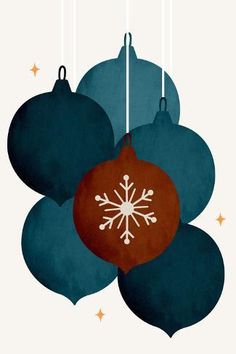 three christmas ornaments hanging from strings with snowflakes on them