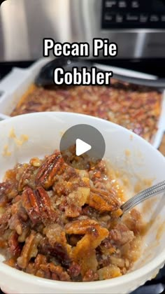 pecan pie cobbler in a white bowl with a spoon on the side and text overlay that reads pecan pie cobbler