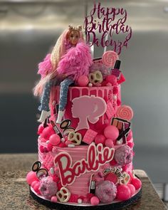 a barbie doll birthday cake with pink decorations