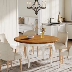 a dining room table with chairs around it