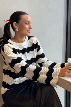 Drop shoulder sweater, long sleeve crew neck finished in multi stripe weave. Multi stripe yarn on relaxed fit. The chic expression of stripe, details the "down-to-earth" your way!Body length from HPS: 21 1/2", Sleeve length: 20", Bust: 40" (Size Small) 60% COTTON 40% ACRYLIC Hand wash cold, Reshape dry flat Imported Chic Striped Crew Neck Sweater, Black Sweater With Striped Long Sleeves, Black Long Sleeve Sweater With Striped Sleeves, Crew Neck Knit Sweater With Striped Sleeves, Knit Crew Neck Sweater With Striped Sleeves, Knit Sweater With Striped Sleeves And Crew Neck, Casual Striped Pointelle Knit Sweater, Winter Striped Pointelle Knit Sweater, Trendy Striped Textured Knit Sweater