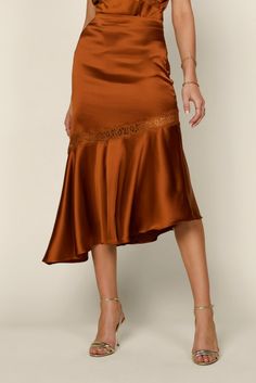 This burnt orange satin skirt is a classy staple, and it is a must-wear for any Fall occasion. It is giving me Serena Van Der Woodsen's thanksgiving outfit vibes. It is super comfortable and easy. Dress it up with its matching lace satin cami or wear it with your favorite sweater for a chic and casual look. Details: 97% Polyester 3% Spandex Side Zipper Closure True to Size Fit Burnt Orange Pencil Skirt Outfit, Relaxed Satin Skirt For Fall, Satin Long Skirt For Fall, Flowy Satin Skirt For Fall, Fall Satin Long Skirt, Silk Long Skirt For Fall, Chic Satin Skirt For Fall, Fall Silk Midi Skirt, Flowy Silk Skirt For Fall