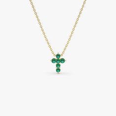 Introducing our 14K Solid Gold Emerald Mini Cross Necklace, featuring 0.18 ctw of emeralds in a dainty and elegant design. This minimalist pendant, showcasing the May birthstone, is perfect for everyday wear or special occasions. Ideal as a meaningful confirmation gift, it blends religious symbolism with modern simplicity. Crafted with care, this necklace offers both timeless beauty and personal significance. * Gold Kt: 14K * Custom Gold Color: Rose Gold, Yellow Gold, White Gold * Length & Width: 9.75x7.25MM * Round Emeralds: 6 Pcs 1.9 MM * Total CTW: 0.18 * Setting Type: Prong Setting * Ready to Ship in 1-2 Business Days ▶ See more of our Emerald Jewelry - https://etsy.me/3QCyZBQ ▶ See our storefront here - http://etsy.me/2lUcVnH  ▶ All store sections here * Diamond Rings - http://etsy.me Emerald Cross, Minimalist Pendant, Gold Armband, Mini Cross, Confirmation Gifts, May Birthstone, Necklace Minimalist, Ruby Jewelry, Emerald Jewelry