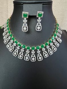 Green Emarald Designer AD Stones/ Premium Quality Necklace Light Weight Necklace and Earring Set/micro gold/South Indian jewelry This item is perfect for parties and festivals! DETAILS: Includes One Choker necklace and two earrings.  Necklace: 13.4 inches. 17 total Extra Chain Lincks will Add Adjustable length. Chain closure. Weighs 1.95 oz (55 g).  Earrings: 1.4 inch(es) long. Earring set weighs 0.20 oz ( 6g) Earring backs push on/off. Material: Imitation Gold Polish Green Emerald, and American Diamond Stone. Finish: Premium GJ gold finish.  NOTE: I try my best to show you photos of my products as they appear in real life, but please note that variations in color occur due to differences in lighting and screen settings.  PRODUCT CARE: - Avoid contact with heat/fire, water, and chemicals s Green Jewelry With Matching Earrings For Celebration, Elegant Gold Plated Green Jewelry Sets, Green Jewelry Sets With Matching Earrings For Celebration, Elegant Green Gold Plated Jewelry Sets, Elegant Green Gold-plated Jewelry Sets, Formal Green Gold-plated Jewelry, Green Gold Plated Jewelry Sets For Party, Green Gold-plated Jewelry Sets For Party, Green Emerald Necklace Hand Set For Party