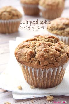 a muffin is sitting on top of a napkin with the words oatmeal spice muffins above it