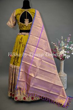 Mehendi Green and Light Purple Kanchi Silk Lehenga With Kanchi Kalamkari Dupatta. This exquisite Mehendi Green and Light Purple Kanchi Silk Lehenga is hand-loomed with embroidered details, making it perfect for brides and special occasions. It features Kanchi silk and hand-woven Kanchi Kalamkari Dupatta to truly make it a unique and elegant style. Look beautiful and stand out on your wedding day or any bridal event. Lehenga With Kalamkari Dupatta, Kanchi Dupatta, Kalamkari Dupatta, House Warming Ceremony, Lehenga Blouse, Bridal Event, Silk Lehenga, Blouse Material, Embroidered Details