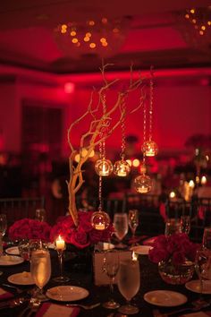 the centerpieces are decorated with candles and flowers