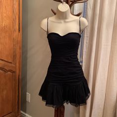 This Is A Black Mini Dress From Forever 21 That Comes With A Diamant Bow Belt. This Dress Is A Size Small And It Runs Very Very Small. I Am 90lbs And I Could Not Get The Zipper Past My Hips. This Dress Is Also Very Short It Reaches My Knees Exactly And I Am 5ft. That Being Said, The Cut Of This Dress Is Adorable And The Belt Is Not Attached And Can Be Used On Other Pieces. The Dress’ Cups Are Padded And It Has That Lining On Top To Help Keep It Up. Nwt. Black Corset Dress Short, Belt Over Dress, Worst Witch, Bow Belt, The Worst Witch, Black Mini Dress, Black Mini, Forever 21 Dresses, Mini Black Dress