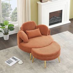 an orange chair and ottoman in front of a fire place with a magazine on the floor