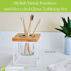 toothbrushes in a glass holder with bamboo and recycled glass tabletop set