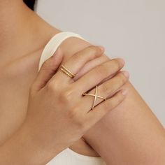 Make a sparkly statement with our X Diamond Criss Cross ring. High quality grade 5A CZ's set through out. It has the wow factor to be worn alone or stacked with our other rings. - Made in gold vermeil: a thick 18k gold layer on sterling silver.- Height: 20 mm x Length: 19 mm- Band thickness: 1.45 mm.- Waterproof, tarnish resistant & hypoallergenic If you are in between sizes, we recommend sizing up. Ring Size Chart Sparkly Rings, Cross Rings, X Ring, Criss Cross Ring, Sparkly Ring, Diamond Eternity Ring, Cross Ring, Eternity Ring Diamond, Silver Plated Jewelry