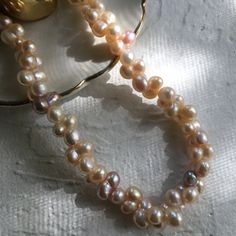 length:16 inches+2 inches materials:freshwater pearls,14K gold filled Pearls measure about 6-7mm wide and 11-13mm tall. Delicate Baroque Pearl Necklace With Round Beads, Pear-shaped Pearl Necklace With High Luster, Pear-shaped High Luster Pearl Necklace, High Luster Pear-shaped Pearl Necklace, Pink Baroque Pearl Necklace With Pearl Charm, Tiny Pearl Necklace, Keshi Pearl Necklace, Black Freshwater Pearls, Black Pearl Necklace