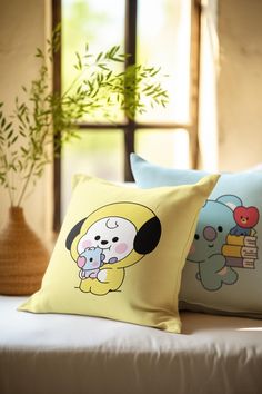 two pillows with cartoon characters on them