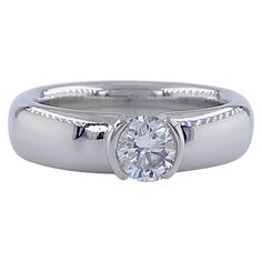 Tiffany & Co. Etoile Diamond Solitaire Engagement Ring Style: ETOILE Ref. number: 27676642 Metal: PT950 Platinum Size: 5.75 sizable TCW: 0.56 cts Main Diamond: Round Brilliant Diamond Color & Clarity: H, VVS2 Hallmark: ©TIFFANY&Co. PT950 27676643 .56CT Includes: T&C Ring Box - Certified Appraisal Retail: $6,850 Sku#16000TLK070621-5.75 Tiffany Co Rings, Engagement Rings Platinum, Engagement Ring Styles, Diamond Solitaire Engagement Ring, American Diamond, Jewelry Rings Engagement, Solitaire Engagement, Ring Box, Solitaire Engagement Ring