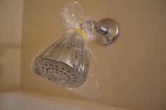 a shower head with the words to get the bath up residue off your shower head