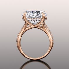 an engagement ring with a cushion cut diamond in the center