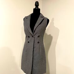 This Beautiful Sleeveless Lined Cloth Dress, Button Front Looks Like A Coat Is Very Beautiful, It Is New Gray Color,Size S Measurements Chest: 18” Weist: 30” Length: 34” Self 90% Polyester 10% Rayon Lining :100% Polyester Semi-formal Sleeveless Vest With Button Closure, Sleeveless Semi-formal Dress With Button Closure, Semi-formal Sleeveless Dress With Button Closure, Fitted Sleeveless Knee-length Dress With Button Closure, Fitted Sleeveless Mini Dress For Semi-formal Occasions, Classic Sleeveless Mini Dress For Daywear, Fitted Sleeveless Mini Dress With Button Closure, Classic Sleeveless Dress With Button Closure, Chic Button-up Sleeveless Dress For Work