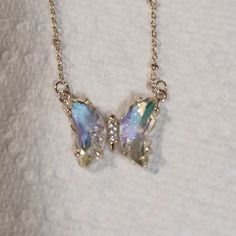 Lovestylize "Blaine" Necklace, Clear Iridescent Crystal Butterfly Charm. Gold Plated Brass Chain, 16.5 Inches Plus 3 Inch Extender. This Was A Gift So I'm Not Sure Why The Tag Is Stapled On. Maybe That's How The Maker Sends It But It Looks Odd, So I'm Not Labeling It Nwt. Smoke-Free Pet-Friendly Home. I Included As Many Different Photos As Possible To Show How The Charm Picks Up And Reflects Various Colors Around It. Butterfly Things, Crystal Jewelry Necklaces, Different Photos, Body Accessories, Fairy Necklace, Iridescent Crystal, Crystal Butterfly, Dragonfly Necklace, The Maker