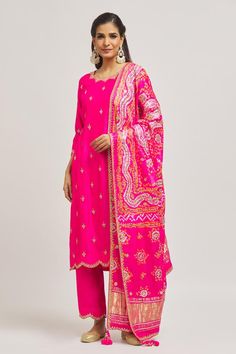 Rani pure spun silk kurta with gota and mirror hand embroidery. Comes with pant and a pure organza dupatta.
Components: 3
Pattern: Hand embroidered
Type Of Work: Gota, Mirror
Neckline: Scalloped Neck
Sleeve Type: Three quarter
Fabric: Pure satin organza
Color: Pink
Other Details: 
Side slits on kurta
Embroidered borders on dupatta
Occasion: Mehendi and Haldi - Aza Fashions Dola Silk Kurta With Gota Work In Traditional Drape, Dola Silk Kurta With Gota Work, Dola Silk Palazzo Set With Mirror Work, Silk Palazzo Set With Mirror Work And Straight Kurta, Straight Kurta With Gota Work In Dola Silk, Unstitched Silk Kurta With Mirror Work, Navratri Chanderi Palazzo Set With Mirror Work, Festive Dola Silk Palazzo Set With Mirror Work, Semi-stitched Palazzo Set With Gota Work In Chinon