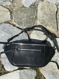 "Do you like the convenience of a waist pack to keep your hands free while shopping or traveling? Look at this wonderful small fanny pack from Tefia made of natural black leather. Fashionable zipper bag look so attractive and unique! This bum bag is versatile and can be carried as a crossbody coin purse and a travel money belt or hip pouch. Our utility bag is a very trendy and comfy accessory both for men and women. The personalized bag has one main compartment, one pocket inside for small items Travel Belt Bag With Pouch Shape, Travel Belt Bag With Belt Loops, Modern Zipper Pouch Belt Bag For On-the-go, Leather Belt Bag With Zipper Pouch For Travel, Black Crossbody Belt Bag With Zipper Pocket, Casual Pouch Belt Bag With Belt Loops, Casual Belt Bag With Pouch Shape, Black Belt Bag With Belt Loops For Everyday, Everyday Carry Belt Bag With Removable Pouch