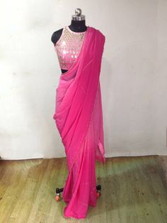 Graded pink ( light to dark) georgette embroidery saree with beautiful zardosi embroidery lines. Blouse is available as a seperate listing. The saree can be made in other colors as well Blouse: https://www.etsy.com/listing/957833251/custom-fit-graded-pink-mirror-work Festive Pink Pre-draped Saree With Mirror Work, Designer Pink Pre-draped Saree With Cutdana, Pink Pre-draped Saree With Gota Work, Pink Party Wear Pre-draped Saree With Mirror Work, Designer Pink Pre-draped Saree With Zari Work, Pink Chinon Pre-draped Saree For Navratri, Pink Cutdana Pre-draped Saree For Party, Pink Pre-draped Saree With Mirror Work, Designer Pink Saree With Zari Work