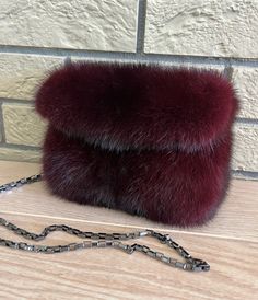 All our garments are new, handmade, unused, high quality craftsmanship, from genuine material. They have been processed through a professional cleaning. Nothing is reused or recycled.  DETAILS: *Made from mink fur *Handmade  *Magnet closure *Pull through chain strap *Dimensions: 20cm X 15cm *Burgundy color *Made in Greece The real color of the item may be slightly different from the pictures shown on website caused by many factors such as brightness of your monitor and light brightness Feel free Elegant Faux Fur Winter Bag, Elegant Faux Fur Bags For Winter, Elegant Evening Shoulder Bag With Faux Fur Lining, Elegant Rectangular Faux Fur Bag, Winter Evening Bag In Faux Fur, Winter Evening Bags In Faux Fur, Winter Evening Bags With Faux Fur, Elegant Winter Bags With Faux Fur Trim, Elegant Winter Shoulder Bag With Faux Fur Lining