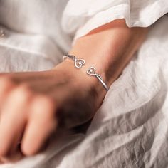 If you're looking for a beautiful and sentimental way to show your best friend some love, this bracelet is a perfect choice. The sleek, minimalist design is perfect for everyday wear, and the two delicate hearts represent you and your best friend, reminding you of all the good times you shared together. Whether you wear it as a daily reminder of your special bond or give it to your best friend as a gift, this bracelet is sure to be cherished for years to come. Why buy from us?: Crafted in Solid Trendy Silver Heart Bracelet For Friendship, Double Heart Charm Jewelry For Best Friend, Heart Charm Double Heart Jewelry For Best Friend, Trendy Metal Bracelets For Mother's Day, Minimalist Heart Charm Jewelry For Best Friend Gift, Minimalist Jewelry With Heart Charm For Best Friend Gift, Minimalist Heart Charm Jewelry For Best Friend, Trendy Adjustable Chain Bracelet For Valentine's Day, Trendy Heart Bracelet For Friendship