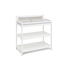 a white baby changing table with two shelves on each side and one shelf below it