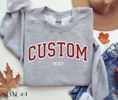 Custom Sweatshirt, Custom Varsity Crewneck, Custom Shirt, Personalized Sweatshirt, University Sweaters, Custom Quote, Vintage Sweatshirt. Our sweatshirts are made with 50% cotton and 50% polyester. Custom designs are available in other shirt styles. Go to our shop homepage for more options! **Our custom shirts are also available with embroidered text** https://www.etsy.com/listing/1672145815/custom-embroidered-varsity-crewneck Place Your Order With These Simple Steps: 1. Choose your size and shi Collegiate Customizable Crew Neck Tops, Casual T-shirt With Custom Text For College, Casual Fall Tops With Custom Text, Casual Custom Text T-shirt For Fall, Customizable Cotton Varsity Tops, Casual Custom Text T-shirt For College, Collegiate Long Sleeve Customizable Tops, Fall Casual T-shirt With Custom Text, Casual College T-shirt With Custom Text