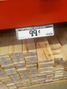 some wooden planks stacked on top of each other in a store display case for sale