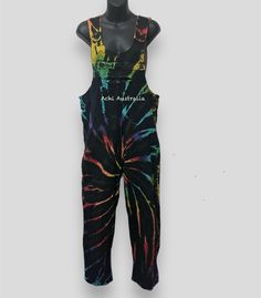 "Our Unique hippie heavy Cotton Rainbow tie dye overall is a comfortable, easy to wear Dungarees style piece. Perfect for warmer weather, this hippie Overalls is a fun piece designed to be functional as well as stylish. It comes in  5 different sizes S,M, L XL, XXL  Features :-         *100% cotton fabric and handmade in Nepal.   * Adjustable length coconut buttons on                shoulders   * Relaxed fit    *wooden buttons         * Two side pockets , one chest pocket with button and two back pockets      Measurements :- Small - Chest width: 28cm - Waist circumference: 92cm(36\") - Length (adjustable strap): 132-137cm Medium - Chest width: 28cm - Waist circumference: 100cm( 39\")  - Length (adjustable strap): 133-138cm Large - Chest width: 28cm - Waist circumference: 102cm(40\") - Leng Casual Multicolor Overalls For Spring, Casual Multicolor Overall Jumpsuits And Rompers, Casual Multicolor Overalls Jumpsuit, Bohemian Cotton Jumpsuits And Rompers With Relaxed Fit, Hippie Style Summer Festival Overalls, Casual Tie Dye Jumpsuits And Rompers For Summer, Cotton Overalls For Summer Festivals, Cotton Summer Overalls For Festivals, Summer Festival Cotton Overalls