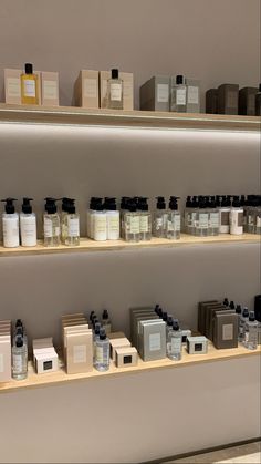 the shelves are filled with different types of perfumes