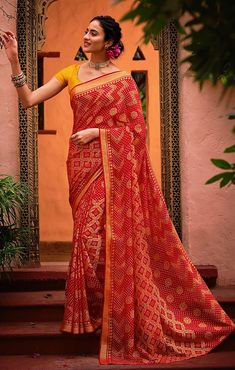 This saree is Ready to Wear (With Fall and Pico Done). Traditional Printed Saree, made up of creative work and graceful fabrics Brasso Comes with 80 cm blouse piece in the saree border Length: 6.30 Meter With Blouse Made up of Pure Fabric Must have saree for your festive collection This saree is a suitable amalgamation of style and grace that is required from ethnic wear. The saree is ideal for any formal gathering. The saree comes with an unstitched blouse of corresponding color and design as s Bandhani Print Pre-draped Saree For Puja, Red Pre-draped Saree With Pallu For Eid, Bollywood Style Red Pre-draped Saree With Self Design, Georgette Saree With Bandhani Print, Georgette Saree With Bandhani Print In Traditional Drape, Bollywood Style Red Pre-draped Saree With Printed Border, Navratri Puja Pre-draped Saree With Printed Border, Festive Bandhani Print Saree Blouse Piece, Red Bandhani Print Pre-draped Saree In Art Silk