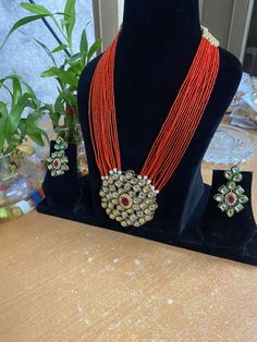 Beautiful Jewelry sure to elevate any look. Feel free to contact me if you have any questions about this item. Adjustable Orange Jewelry For Festivals, Handmade Orange Long Necklace, Handmade Orange Necklace, Handmade Orange Jewelry For Celebration, Orange Beaded Jewelry For Festive Occasions, Orange Jewelry For Party Festivals, Festive Orange Round Bead Jewelry, Kundan Long Necklace, Long Necklace Set