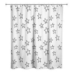 a white curtain with black stars on it