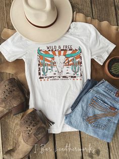 Wild & Free unisex western graphic tee Side seamed Retail fit Unisex sizing 50/25/25 poly cotton rayon Causal Summer Outfits, Western Tees, Nashville Outfit, Western Wild, Rocker Tank, Pjs Set, Western Clothes, Clothing Wishlist, Western Tee