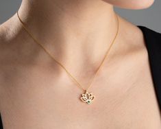 "* Carry the enchantment of nature to your style with the Lotus Flower Charm Necklace. This elegant necklace is designed with the unique beauty of lotus flower. Crafted from high-quality materials, this necklace stands out with its finely processed lotus talisman. While showcasing the mesmerizing natural patterns of lotus talisman, the necklace also dazzles with its sophistication and elegance. The impressive color and stylish design of the necklace will complement any outfit and add a sophistic Elegant Flower Pendant Necklace For Meditation, Elegant Lotus Flower Jewelry Gift, Lotus Flower Pendant, November Birthstone Necklace, Lotus Flower Necklace, Lotus Necklace, Lotus Pendant, Gold Lotus, Flower Charm Necklace