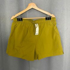 Olive Green Nylon Shorts With White Mesh Inner Lining On Whole Shorts, No Underwear Lining. Great Fit And Feel In Vibrant Color. 3 Inch Inseam, Great For Running. Summer Nylon Shorts With Pockets, Solid Color Athleisure Swim Trunks For Spring, Casual Green Swim Trunks For Workout, Solid Nylon Swim Trunks For Outdoor Activities, Urban Outfitters Green Shorts For Spring, Green Stretch Athletic Shorts With Pockets, Urban Outfitters Green Casual Shorts, Green Bottoms With Functional Drawstring For Outdoor, Green Stretch Swim Trunks With Pockets