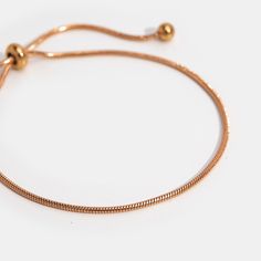 Simple, elegant, and perfect for day or night. This stunning bracelet is guaranteed to be an everyday essential for years to come. Made with waterproof titanium steel, you never need to worry about fading or tarnishing jewelry ever again! Waterproof & tarnish-free Titanium steel Gold or rose-gold plated Slide knot closure Hypoallergenic, lead & nickel free If you aren't in LOVE with your purchase, please let us know within 30 days of receiving your item, and you'll receive a stress-free refund. Gold Chain Bracelet, Rose Gold Chain, Bubble Bag, Black Gift Boxes, Gold Bracelet Chain, Simple Elegant, Simple Jewelry, Crystal Rings, Steel Jewelry