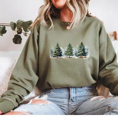 Embrace the winter wonderland with this cozy Snowy Pine trees sweatshirt. Perfect for camping trips or just staying warm during the colder months. This sweatshirt exudes a tranquil and peaceful atmosphere, making it ideal for nature lovers and winter enthusiasts. It's a great gift for Christmas, winter holidays, or any occasion celebrating the beauty of the snowy season. Product features - Knit in one piece without side seams for reduced fabric waste - Ribbed knit collar with seam for elasticity and shape retention - Medium-heavy fabric blend of 50% cotton and 50% polyester for coziness - Classic fit and crew neckline for a comfy wearing experience - Double-needle stitching for top-tier durability Care instructions - Machine wash: cold (max 30C or 90F) - Non-chlorine: bleach as needed - Tu Long Sleeve Winter Sweatshirt For Outdoor Activities, Winter Outdoor Fleece Sweater, Winter Fleece Sweater For Outdoor Activities, Winter Outdoor Crew Neck Hoodie, Winter Crew Neck Hoodie For Outdoor, Casual Winter Sweatshirt For Outdoor Activities, Casual Sweatshirt For Outdoor Winter Activities, Winter Fleece Tops For Outdoor, Winter Outdoor Crew Neck Tops